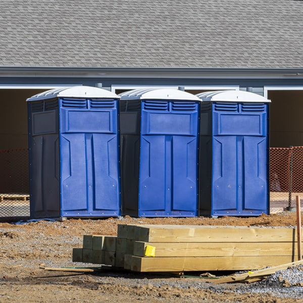 what is the cost difference between standard and deluxe portable toilet rentals in Connersville